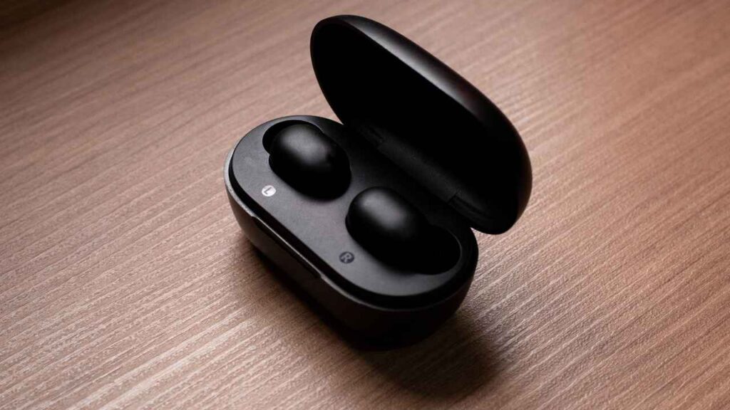 black colored earbuds on the table