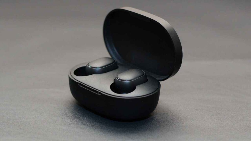 earbuds with the case on the table